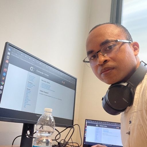 Dr. Ianjamasimanana sitting at his desk working